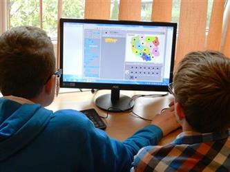 two students using a computer